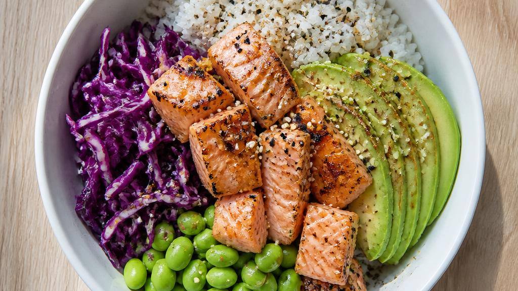 Grilled salmon poke bowl with rice, avocado, and edamame scanned by CalCore AI